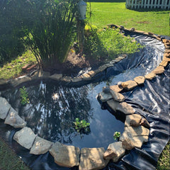 Adroiteet liner edge anchored with stones for secure finish