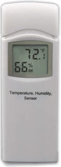 Ambient Weather WS-2801A placed on a patio table showing console and sensor in use for timely local forecasts