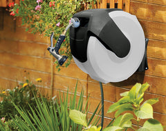 AMES NeverLeak reel in use with hose pulled showing quick retract benefit