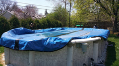 Aquador installed on skimmer in pool setting protecting against ice