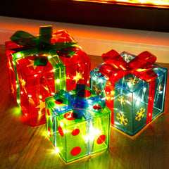 ATDAWN front view of three lighted gift boxes showing festive glow