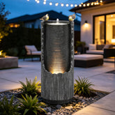 AUTODAYA front view of distressed fluted column fountain showcasing elegant focal point