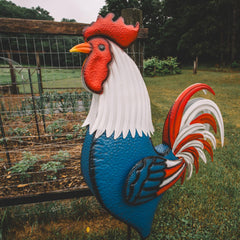 Backyard Expressions rooster next to chair showing scale and placement benefit