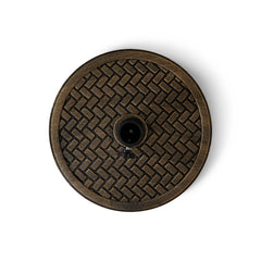 Backyard Expressions umbrella stand in use on patio anchoring umbrella and protecting seating