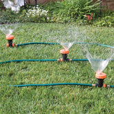 Bandwagon front view of assembled three-head sprinkler showing coverage and easy setup benefit