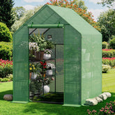 Benass front view of walk-in greenhouse showing organized shelves and zipped door, improves plant protection