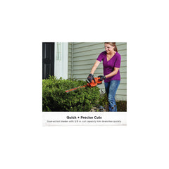BLACK+DECKER in use trimming hedge showing cordless mobility benefit
