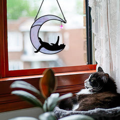 BOXCASA suncatcher hung in window creating warm, whimsical room lighting