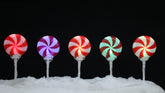 brite star front view of five lollipop pathmarkers creating festive pathway glow