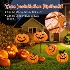 Cbumane pathway display at night with pumpkins adding illuminated curb appeal