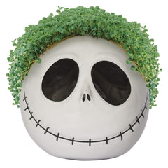 Lifestyle shot of Chia Jack Skellington on a shelf adding whimsical living greenery to a desk benefit: playful display