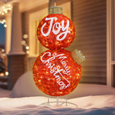 Cinnvoice front view of red stacked ornament showing festive lettering and bright presence