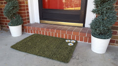 CLEAN MACHINE mat in use at front porch trapping mud from boots effectively