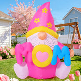 COMIN gnome front view showing pink MOM letters and cheerful design for visibility