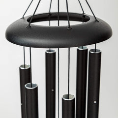 Corinthian Bells hanging on porch illustrating calming patio ambiance