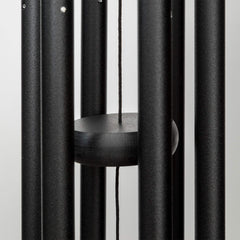 Corinthian Bells next to chair showing 27-inch scale and placement benefit