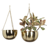 deco 79 front view of the two gold hanging planters for instant glam display