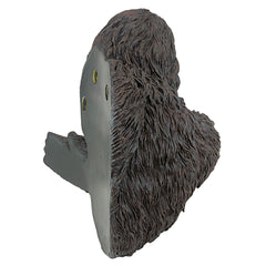 Design Toscano Bigfoot in garden setting next to tree creating whimsical curb appeal