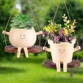 Domensi front view of two beige swing face planters showing playful design and portability