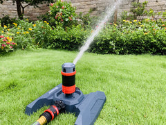 Eden sprinkler in use on lawn showing even coverage benefit