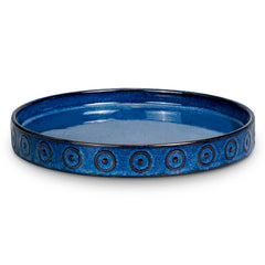 Eightpot front view of blue ceramic saucer shows protective rim and neat finish