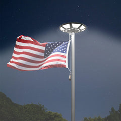 Etzeaxus mounted on flagpole at night illuminating full flag
