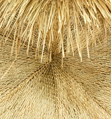 FOREVER BAMBOO palapa skirt on patio umbrella creating tropical ambiance and filtered shade benefit