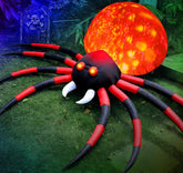 FunFanso front view of 8 ft inflatable spider showing dramatic silhouette and glow