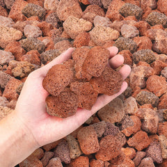 GasSaf lava rocks installed in fire pit hiding burners and enhancing flames
