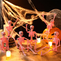 Geelin group of pink skeletons in yard creating festive Halloween atmosphere