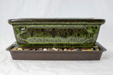 Generic moss green pot front view showing clean lines and glazed finish