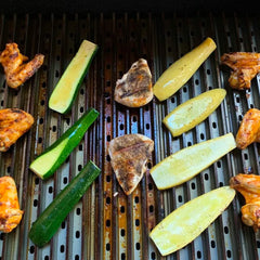 GrillGrate installed on a small gas grill demonstrating even heat distribution and fit