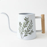 HB Design Co. front view of watering can showing shape and leaf design, attractive display
