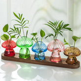 Hewory front view on wooden tray showing colorful mushroom vases and tidy display