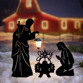 Hokfirm nativity front view showing three stakes and lanterns lighting pathway