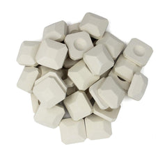 Hongso stacked briquettes showing thickness and compact 2x2x0.7 inch size