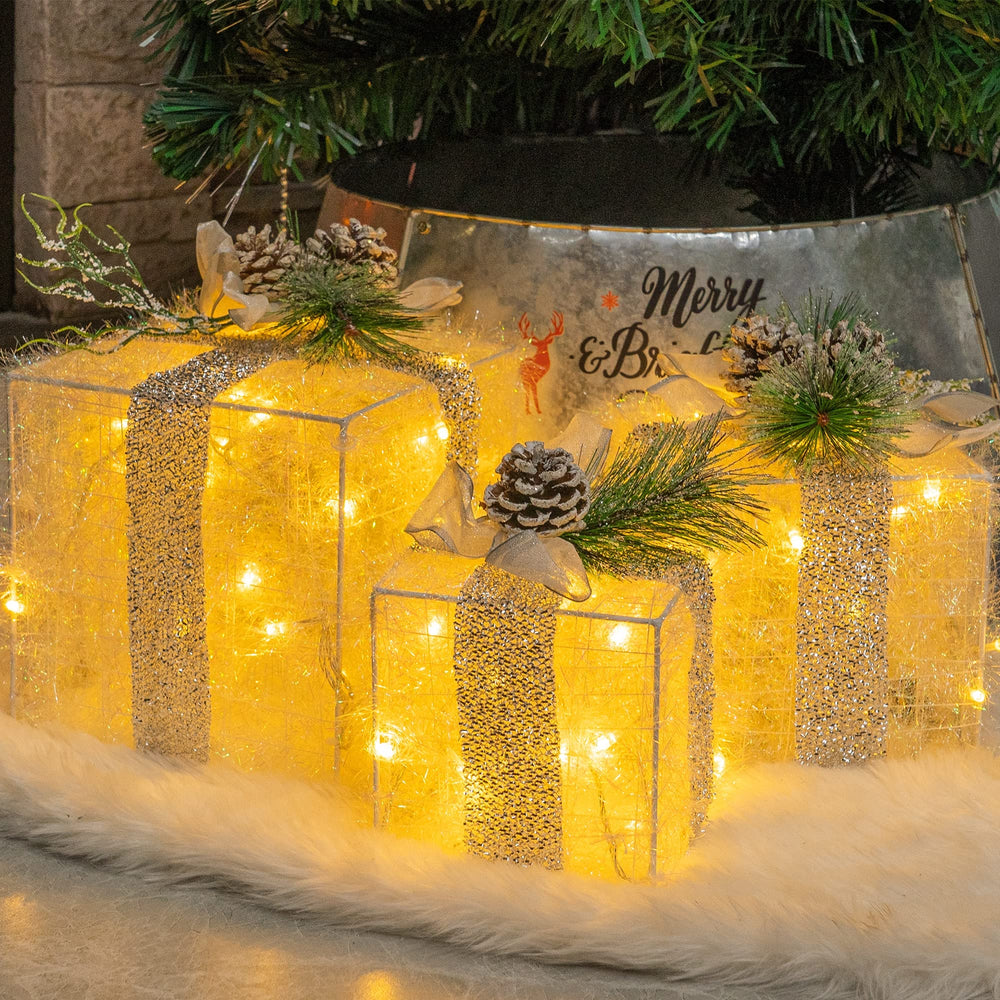 Hourleey front view set showing three lit gift boxes and festive glow