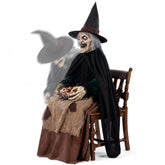 Hourleey front view of seated witch showing spooky pose and instant porch impact