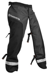 Husqvarna front apron chaps laid flat showing full coverage and durable finish for safety