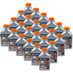 Husqvarna 6.4 oz bottle beside a 2.5 gallon fuel container showing scale