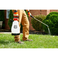 Husqvarna sprayer being used for spot treatment demonstrating precision and control