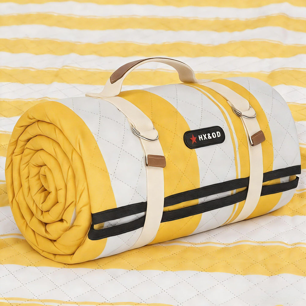 HX&OD front view of yellow blanket folded with strap for easy transport