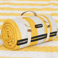 HX&OD front view of yellow blanket folded with strap for easy transport