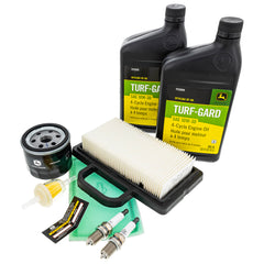 John Deere two quarts of 10W-30 oil close-up illustrating correct viscosity
