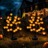 JUSTUP pumpkin stake front view showing bright yellow jack-o'-lantern and festive lighting benefit