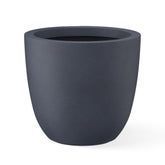 Kante front view of charcoal planter showing modern silhouette and stable base