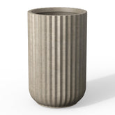 Kante front view of weathered concrete column planter showing elegant profile and stability