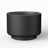Kante front view of black pedestal planter showing modern silhouette and curb appeal