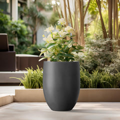 Kante planter drainage plug detail showing removable rubber plug to protect indoor floors