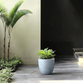 Kante planter front view showing slate gray finish and modern silhouette, enhances décor